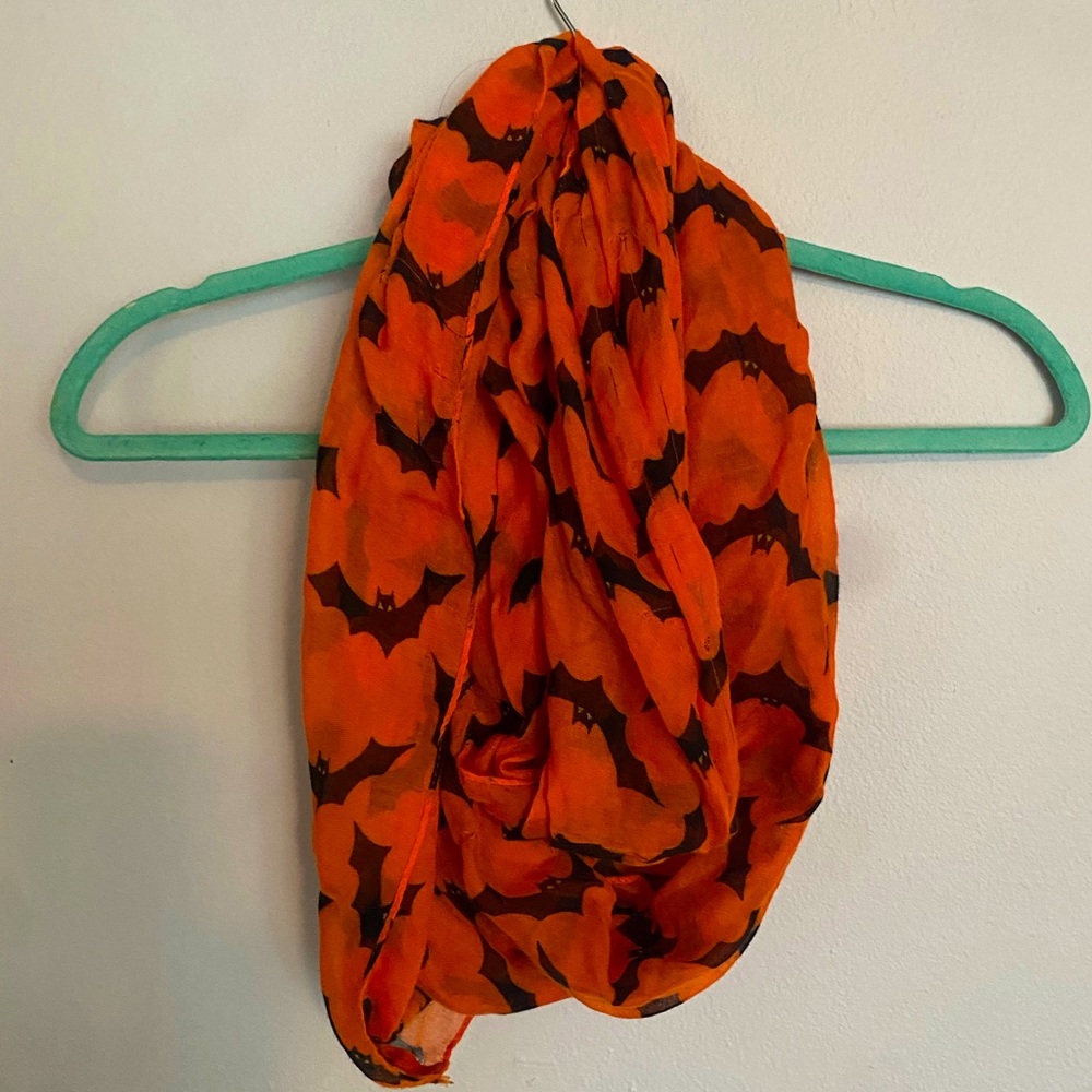 Infinity scarf. Brand Hobby Lobby. Color orange with black bats